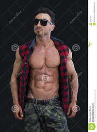 body builder naked male bodybuilder shirt open naked muscular torso frontal shot young man military pants stock photo