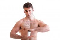 hot male body builders anetlanda athletic sexy male body builder holding boxes supplements his biceps photo