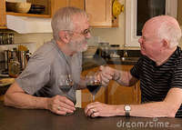 mature gay pic mature gay couple having wine stock