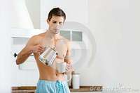 naked male pictures half naked male pouring tea kitchen stock