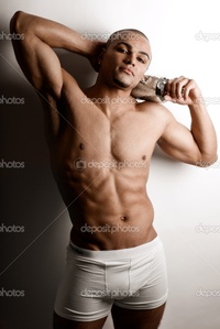 nude bodybuilder depositphotos strong wet sexy nude young bodybuilder posing bottle stock photo