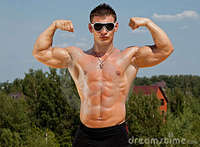 sexy bodybuilder man muscle sexy wet naked man posing beach stock
